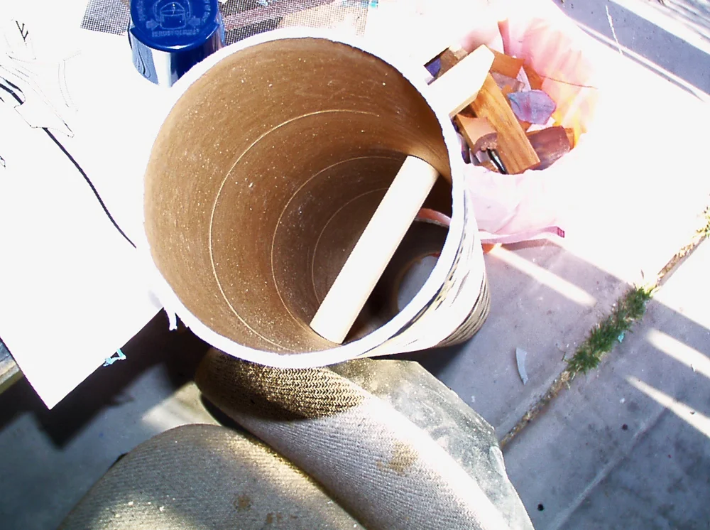 After cutting a hole for the arm to be inserted, I added a wooden dowel to act as a handle.