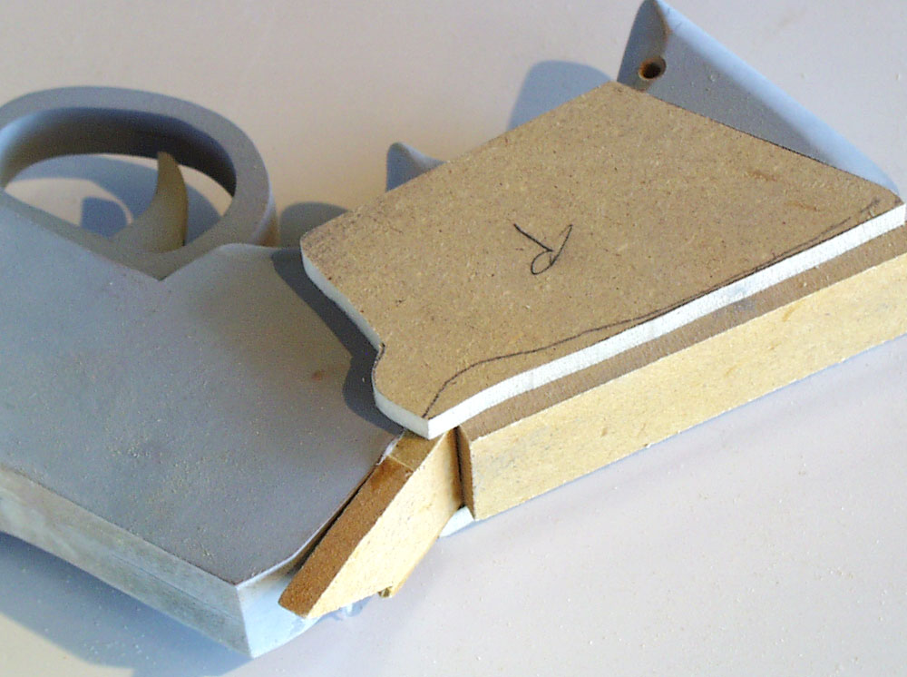  To make the grip plates, I used 1/4″ MDF to make a simple box around the pistol. 