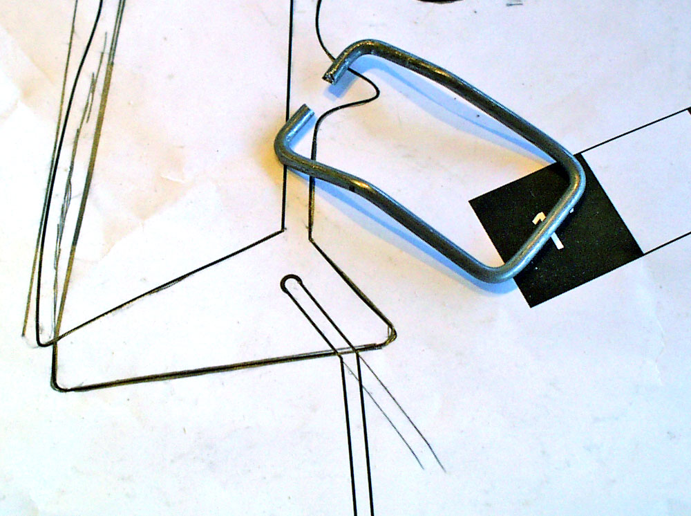 The lanyard loop was made by bending 1/16″ steel wire to shape.