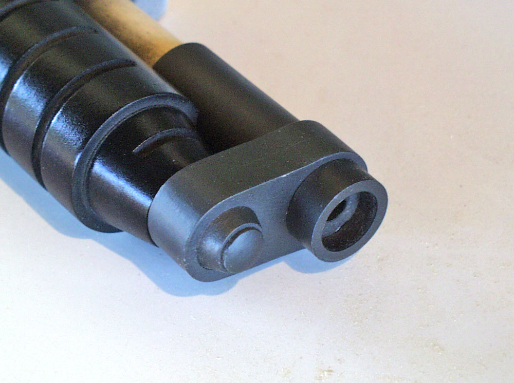 For the exposed barrel, I sanded the inside of PVC pipe so that it would slip over the barrel dowel on either side of the bracket.