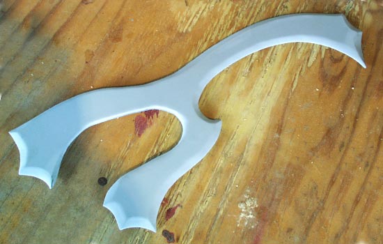 Much putty and sanding refines the curves and bevels