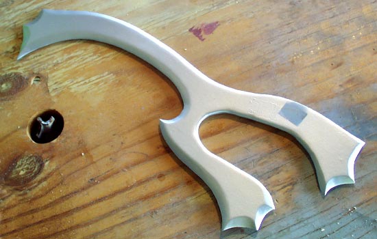 A base coat of silver. The grey square was where the clamps held it during painting.