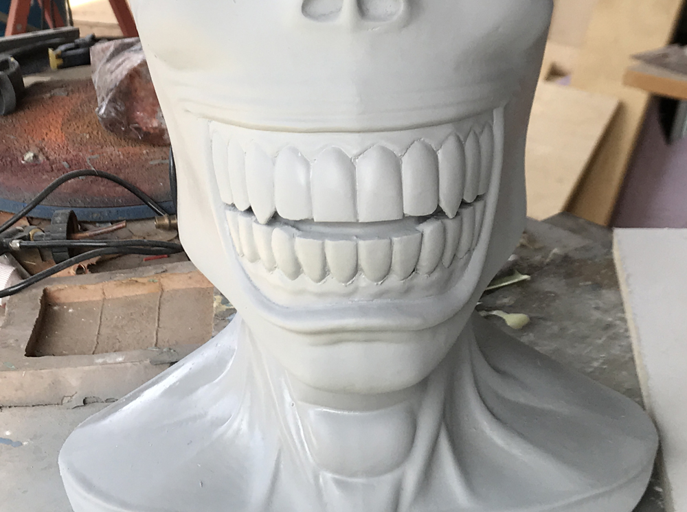  The downside is that it will fill in small detail as well so I think it’s best used for organic shapes. I had to redefine the teeth, lips and gums before laying down a base coat of white with an Xacto blade   