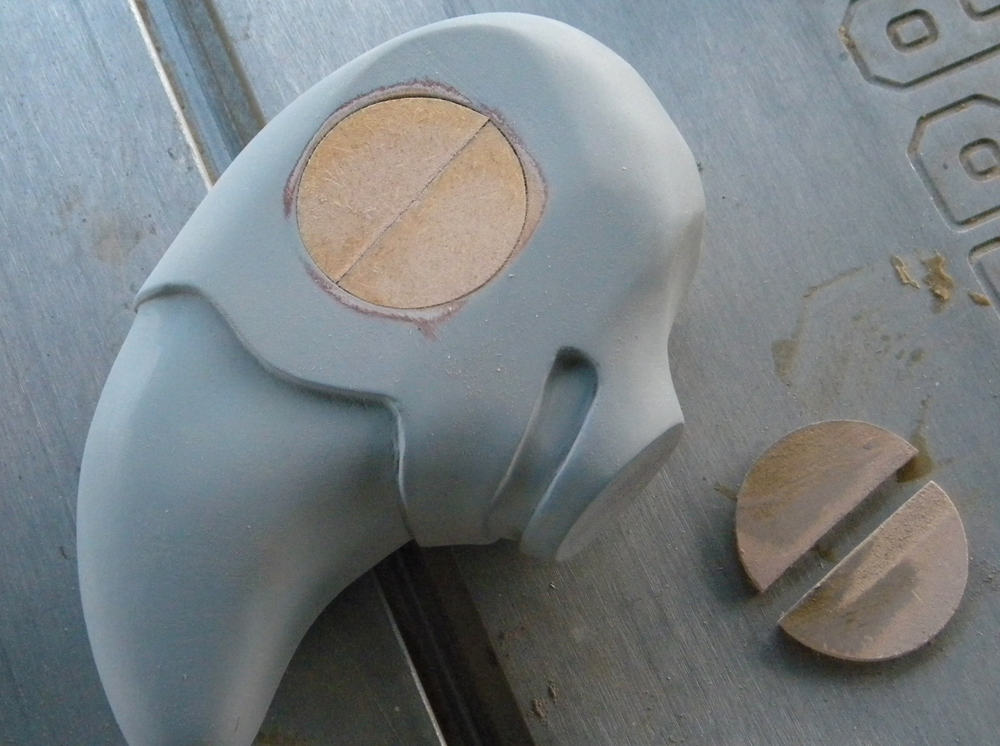  To attach the wings to the head and make sure they were straight, I cut 1/4″ MDF discs that would fit in the eye socket. 