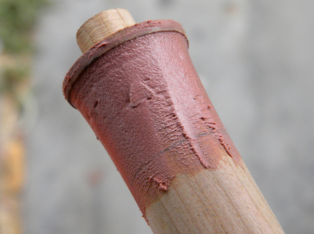  The staff was made from a 1″ oak dowel. I inserted a 1/2″ dowel in the end to attach the tip and flared both ends with Bondo, guided by a slightly larger MDF disc. 