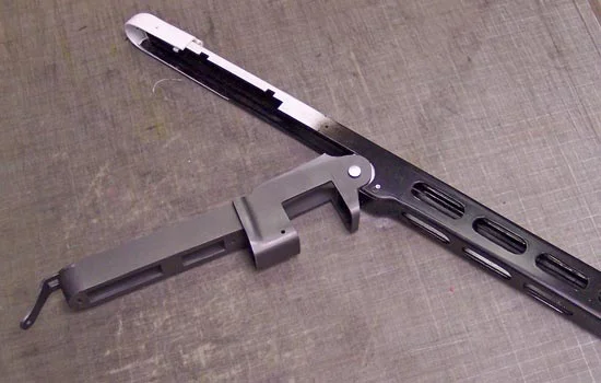 You can see how the upper receiver latch locks into a notch on the lower receiver.
