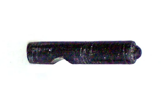 The firing pin fits in the bolt face. For this I cut off a piece from a toy, put it in my hand drill and used a blade to lathe the tip. This piece is only 1/2″ long.