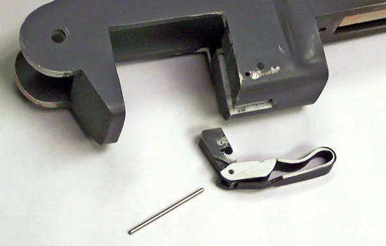 The magazine latch was tricky to figure out but was in fact brilliantly simple in design. You can see a mis-drilled hole when I was trying to figure out the correct position.