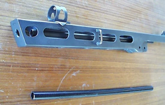 I found a plastic tube with the right outer dimension for the barrel.
