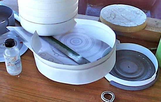 For the side of the drum, I used a plastic jug as the form and pressed the groove directly into that.