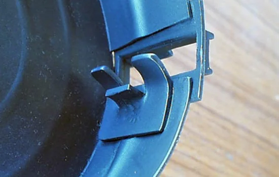 This scoop is inside the opening of the magazine and guides the bullets out of the track. It was also (carefully) heat-formed.
