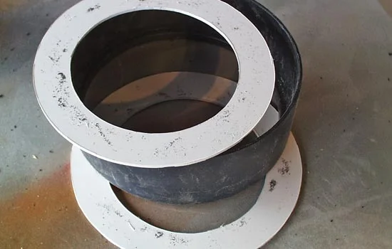 I cut end caps out of styrene leaving a hole to fit the shaft.