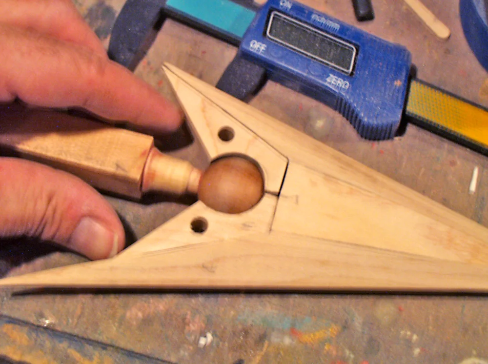 The arrowhead inserts were made from scraps of maple. The tail spike couldn’t be glued to the shaft until these pieces were in place.