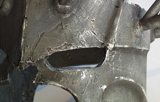 A final drybrushed coat of silver pulls it all together. Edges are hit with a highlight of silver to simulate scuffed metal.