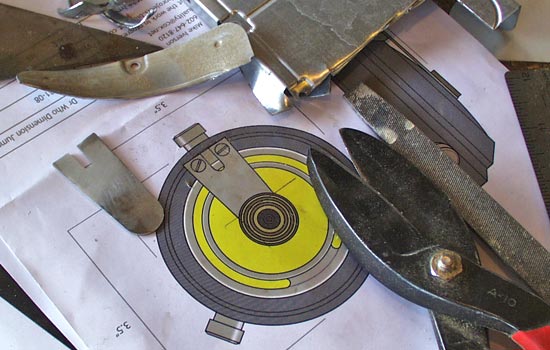  I used tin snips to cut the metal “tongue” out of an old hard drive sled. 