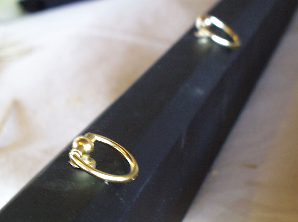  I added two rings to the scabbard so that it could be worn from a belt. 