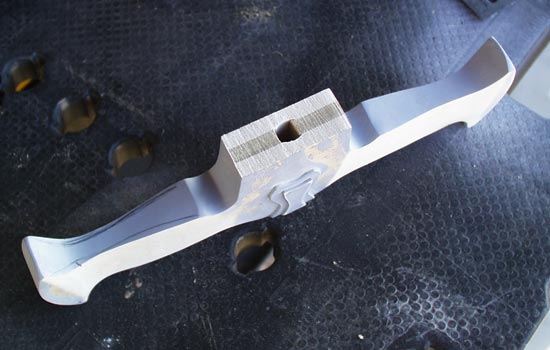 I didn’t like the blockiness of the guard so I popped off the plastic and sanded contours to the guard. I heat formed the plastic detail to fit.