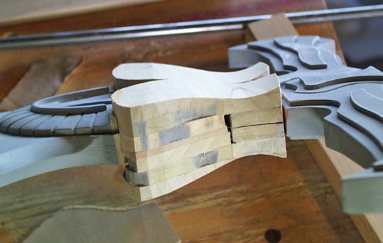 The blade cap was made with pieces of 1/4″ poplar glued together instead of MDF. I shaped it on the belt sander