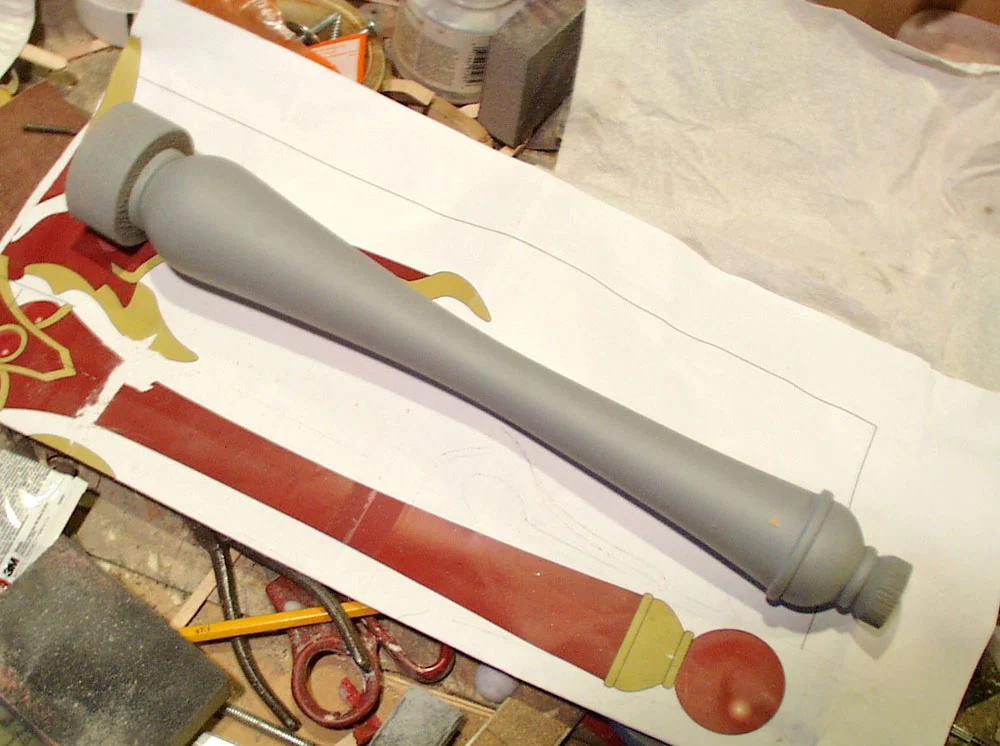 The handle was made from Bass Wood and turned on a lathe.