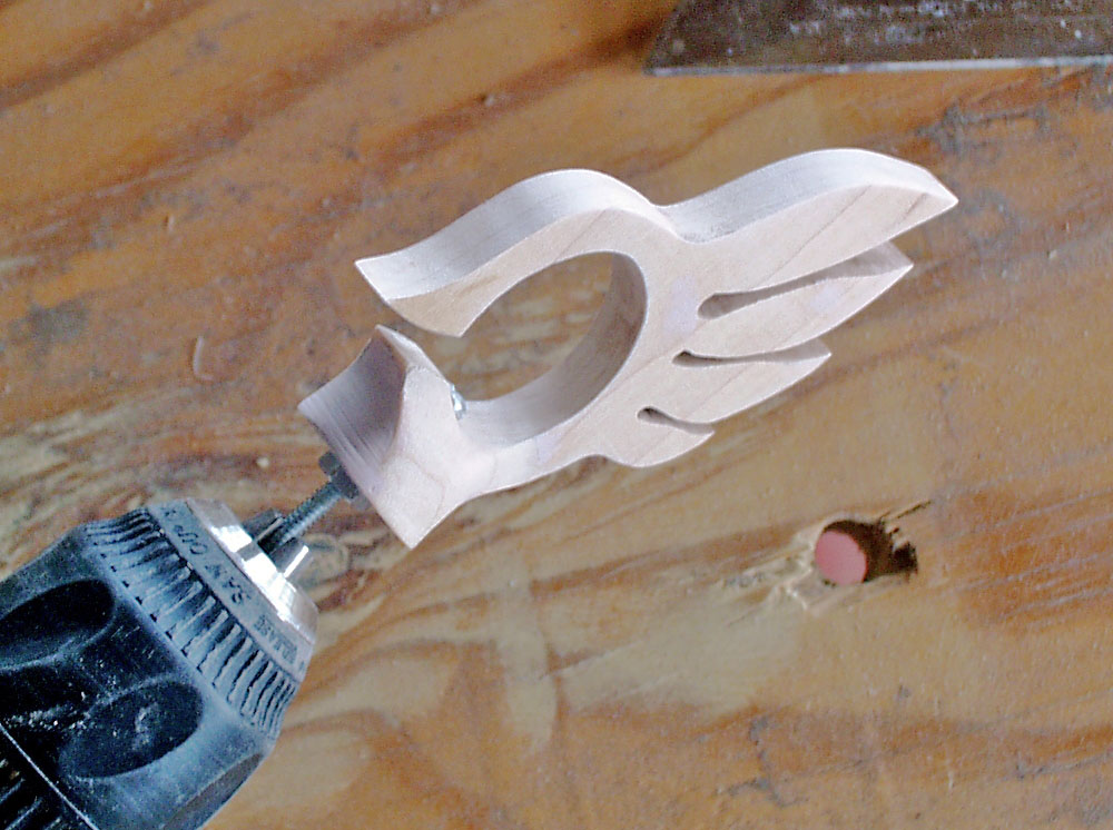 I attached it to a hand drill and smoothed out the base with files and sandpaper.