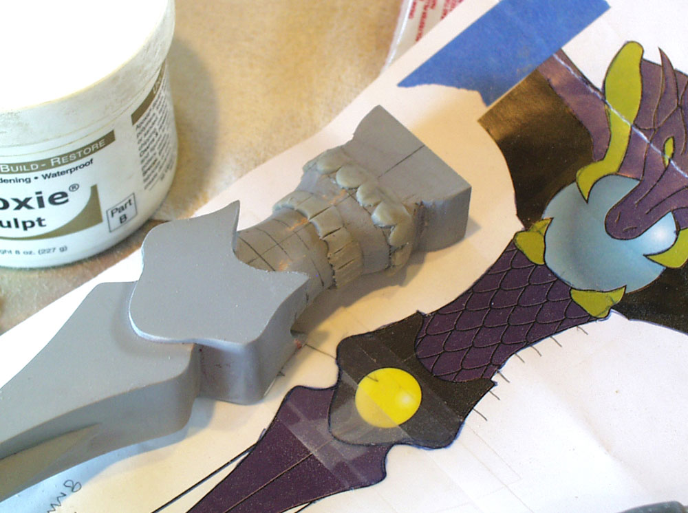 I used epoxy putty to add scales to the dragon bodies.