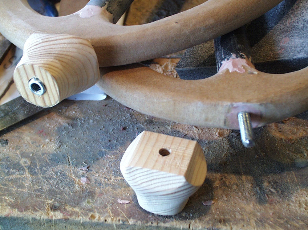  A base for the ring handle was made from pine with threaded inserts. 