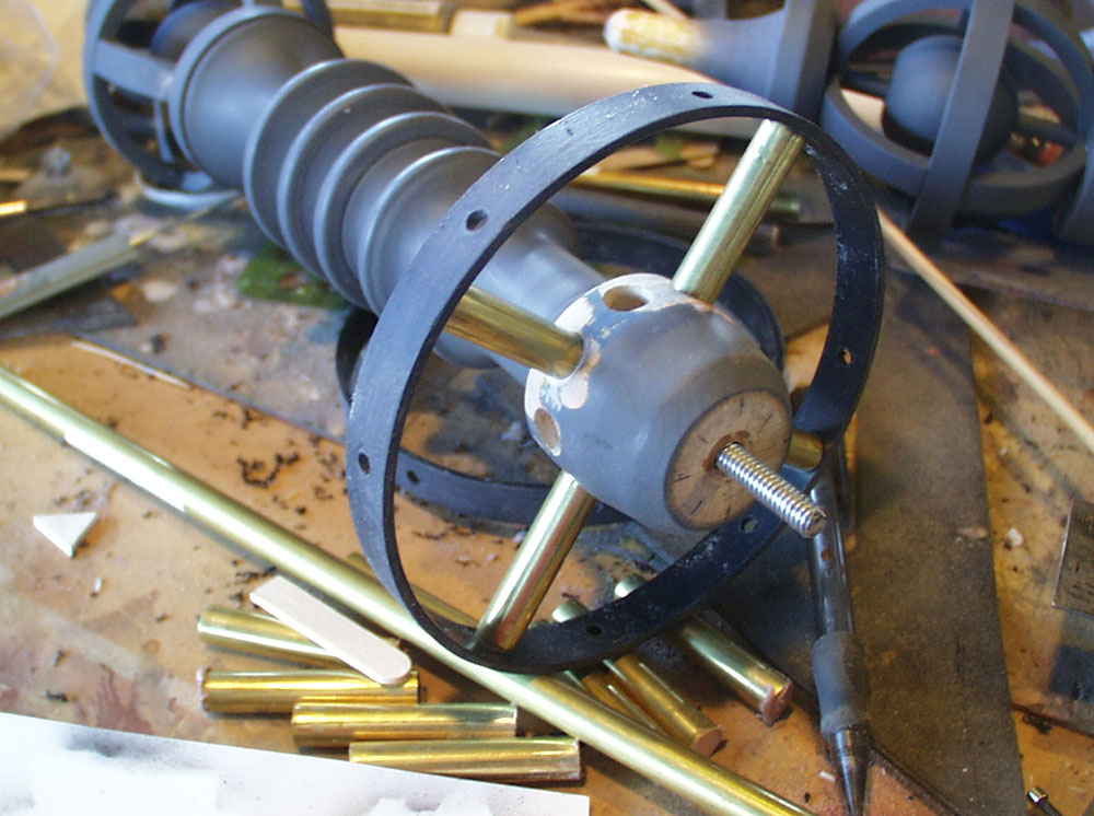  I used brass tubes drilled into the wood to support the plastic ring. 