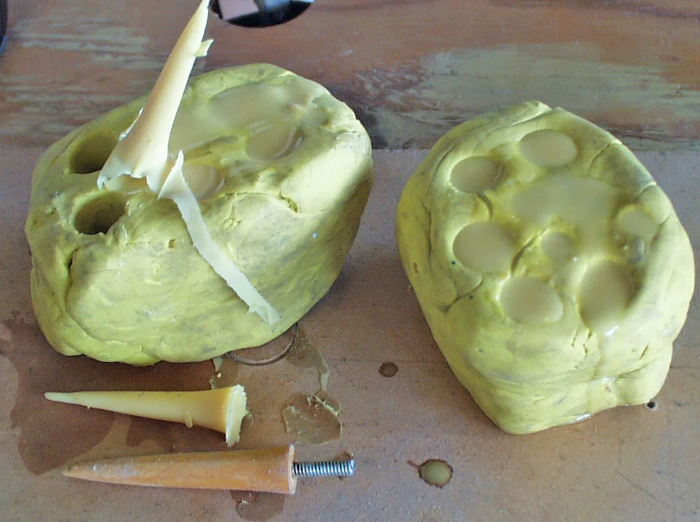 To ensure the safety of those within poking distance, I decided to make the spikes from urethane rubber. After shaping a wooden master, I used clay for a simple push mold.