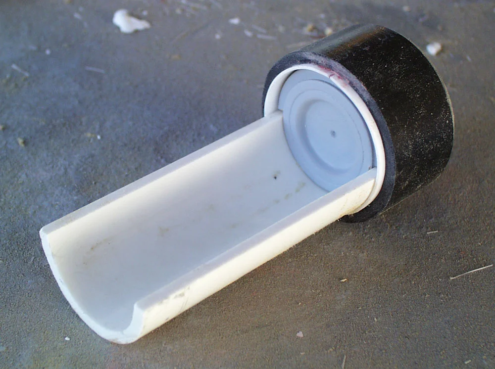 The slide was made from a section of PVC. I lathed an interior to the cap from MDF.