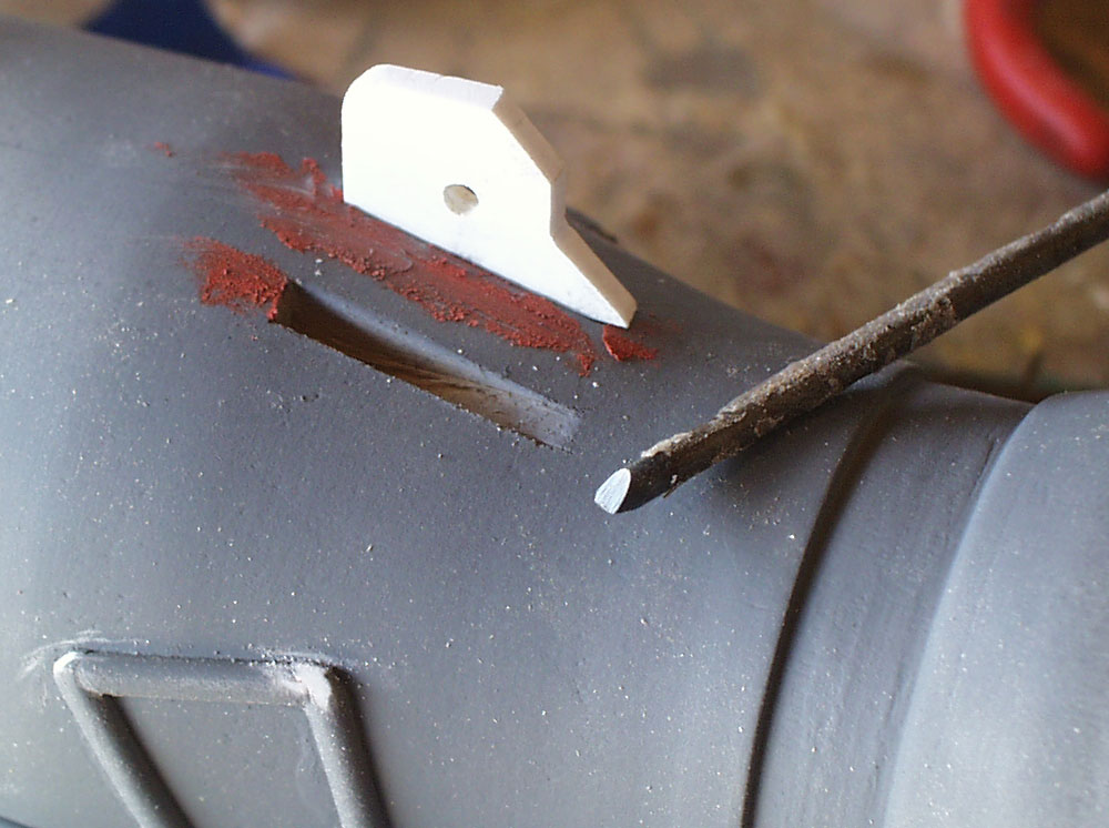  The brackets that hold the other end of the trigger piston are made from 1/8″ styrene. I made a small chisel to carve out the slots in the barrel. 