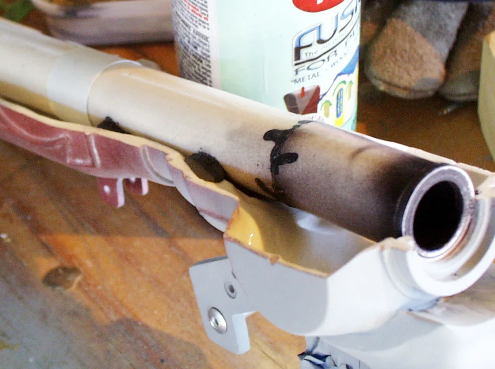 I used a 3/4″ PVC pipe for the barrel of the caster. I painted the inside black and attached it to the lower barrel with epoxy putty.