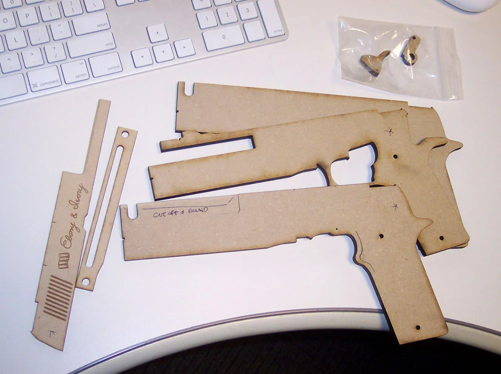 I planned out the guns so they could be built using layers of laser-cut MDF. This would allow for maximum accuracy as well as the engraving on the barrels.