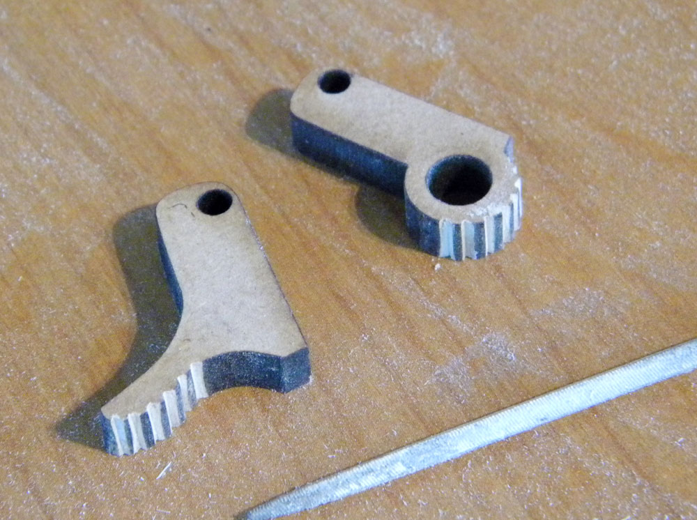  I forgot to add the serrated edges on the hammers when I had them laser cut so I had to manually add them with a file. 