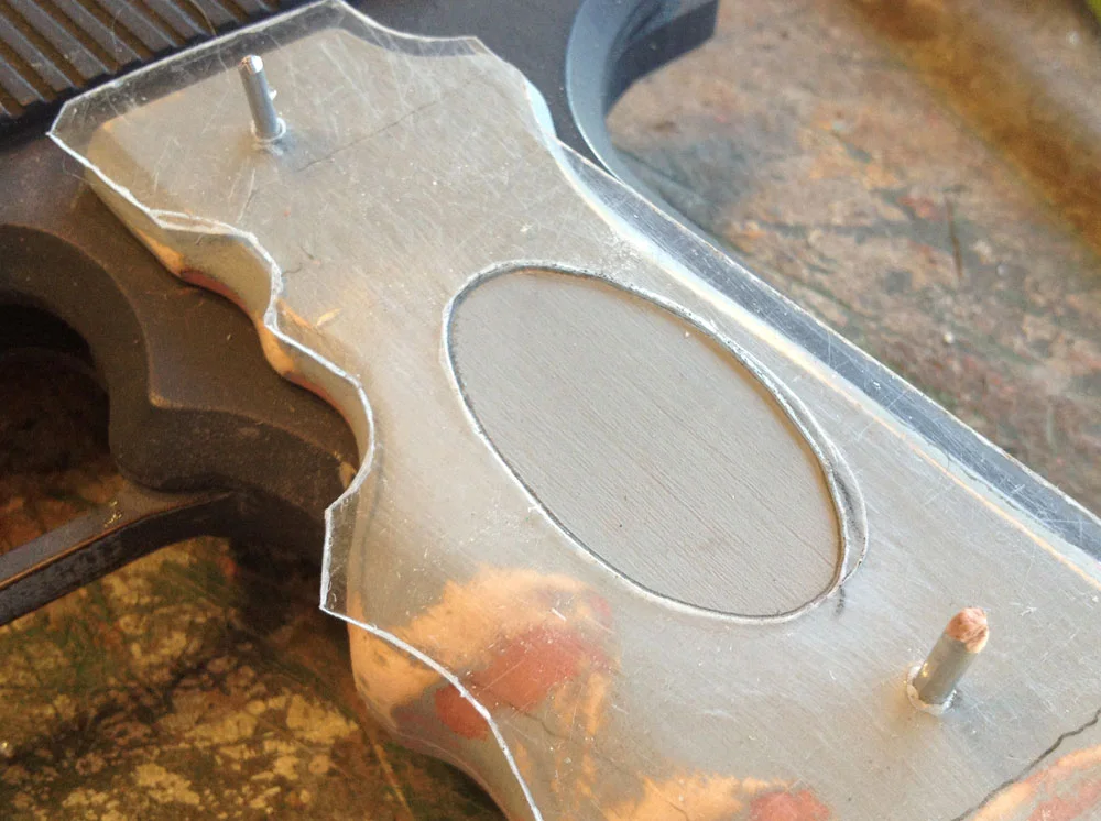 I pegged the template in place and traced the oval.