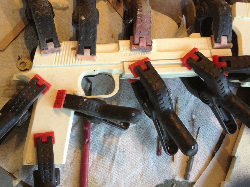  I applied some two-part epoxy and clamped the gun bodies to dry. 