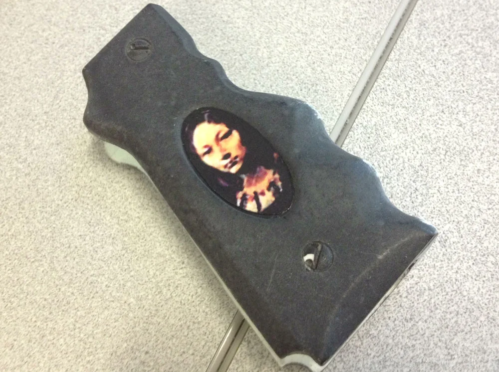The final step is to apply the cameos. I laser printed each portrait on label stock, trimmed them out and inserted them into the grip. The label was sealed with a spray acrylic enamel clear coat.