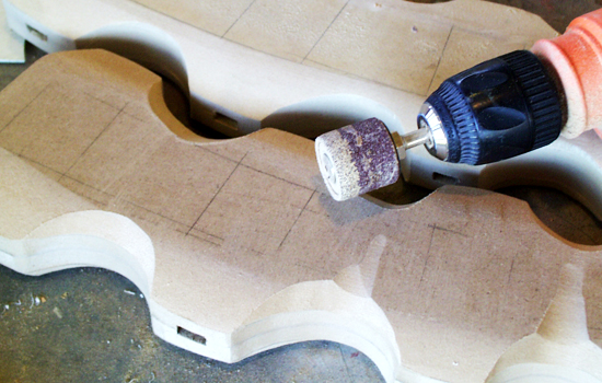 Using a sanding drum in a hand drill, I shaped the depressions. 