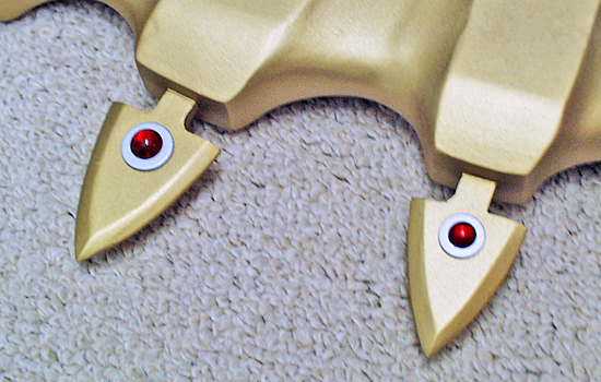 I glued acrylic gems to silver-painted washers and then attached them to each side of the points.