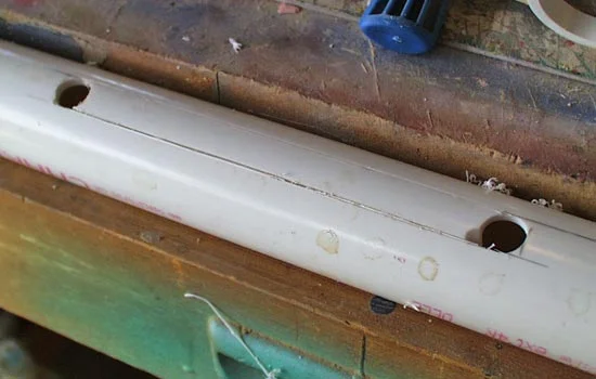For the bolt slot, I drilled two holes and then cut between them, removing a section of the PVC.