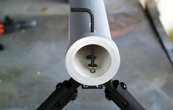 I used the supplied screws but attached the bipod from inside the barrel, through two access holes I drilled above them.
