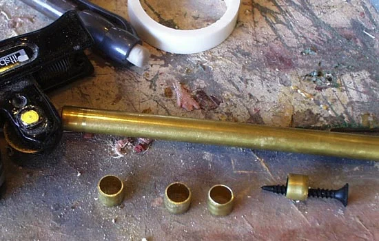 I cut posts from brass tubing that will also hide the knob attaching screw.