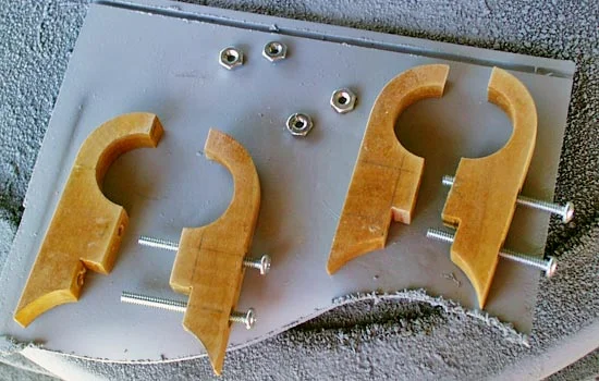 I cut each in half and inserted long bolts to attach them. The bottom bolt goes through the rail.