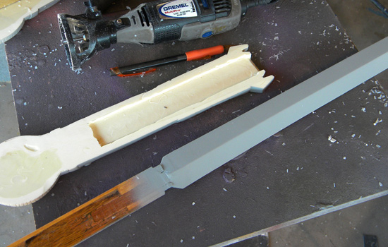 I used the cutting attachment on my Dremel as a router to carve a slot in both halves.