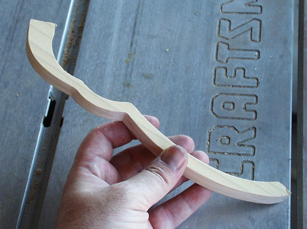  The pieces were glued together and sanded smooth. I left a little on each end to attach to the grip and basket guard. 