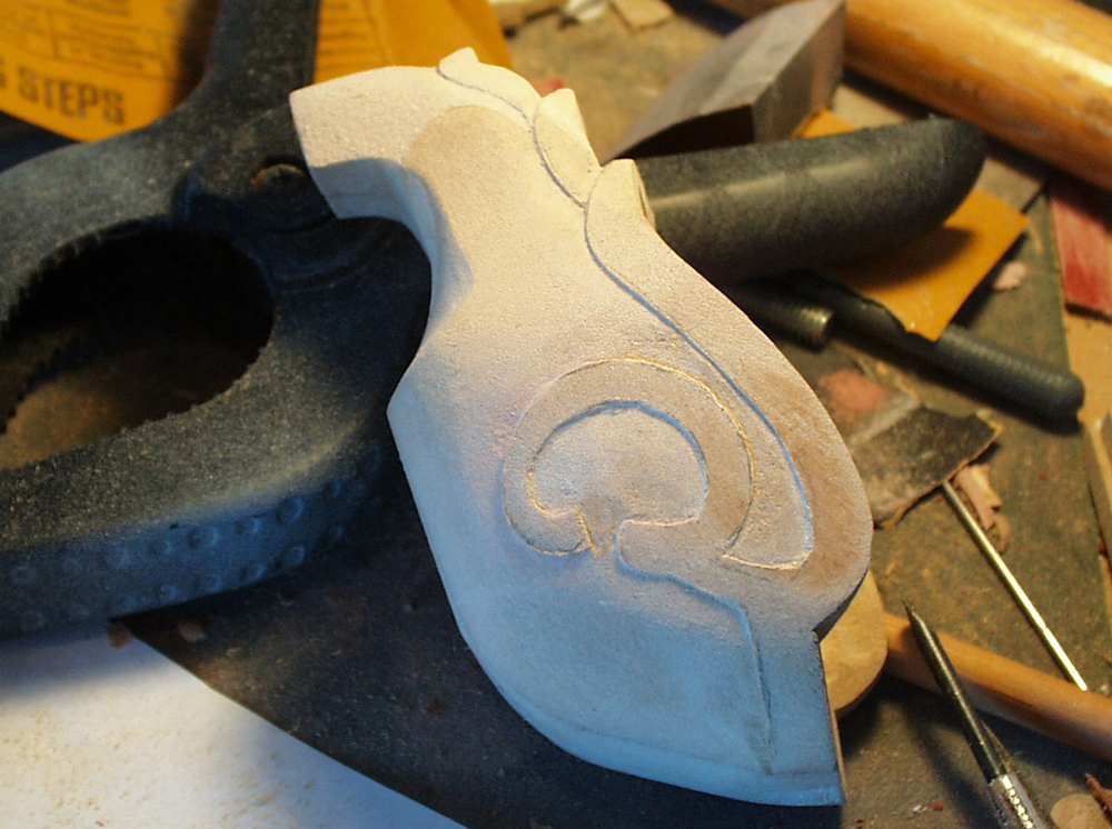  To make the trim, I used an Xacto knife to trace the outline and then carved out the recessed areas. 