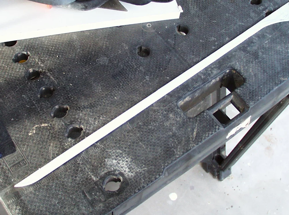 The plastic was then cut to shape. An edge was scraped using a pocket knife, as illustrated in my Spartan sword entry.