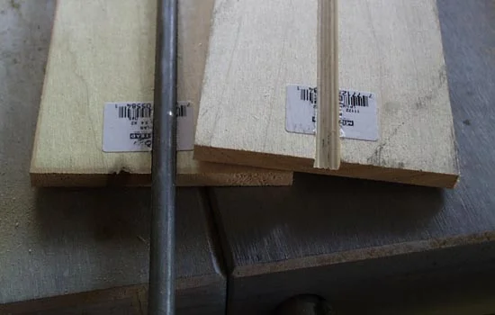 I started with the blade by cutting a groove through two sheets of 1/4″ poplar to house a 5/16″ steel rod.