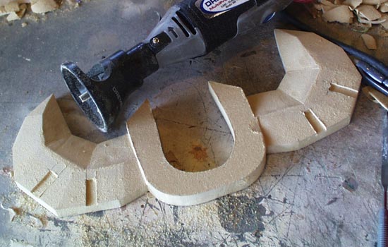  The MDF was shaped with belt sander, dremel and file to get the appropriate facets. 