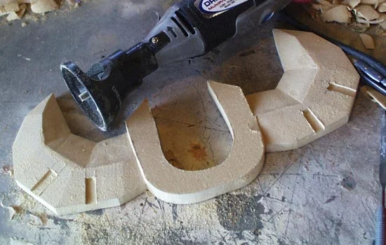 The MDF was shaped with belt sander, dremel and file to get the appropriate facets.