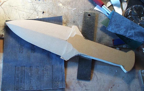  After gluing the blade halves together, I shaped the blade edges on the belt sander. 
